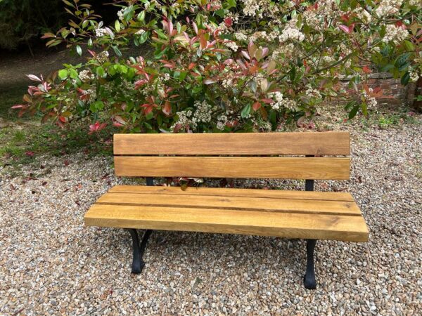 Oak bench is in garden