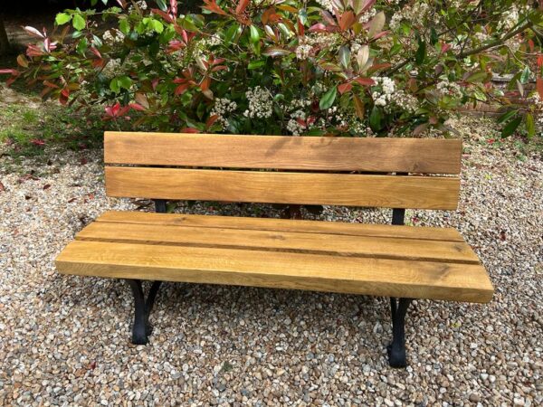 Solid wood Oak bench in garden